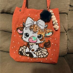 Womens Orange Sequin Cow Tote Bag with Pom Charm
